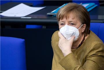 Bundeskanzlerin Angela Merkel (CDU) sitzt nach ihrer Regierungserklärung zu den Ergebnissen der Bund-Länder-Runde zur Bewältigung der Corona-Pandemie in der Plenarsitzung des Deutschen Bundestages. 