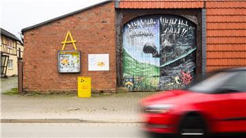 Ein Graffiti mit dem Schriftzug „Eure Kinder werden euch zur Rechenschaft ziehen“ steht auf einer Scheune im Stadtteil Schacht Konrad.